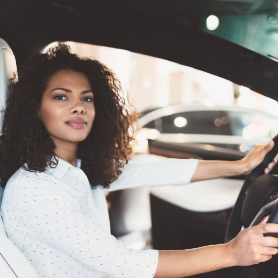 Woman enjoying luxury car