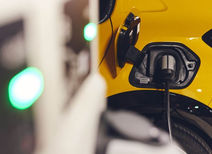 Electric car charging in underground car park in mall